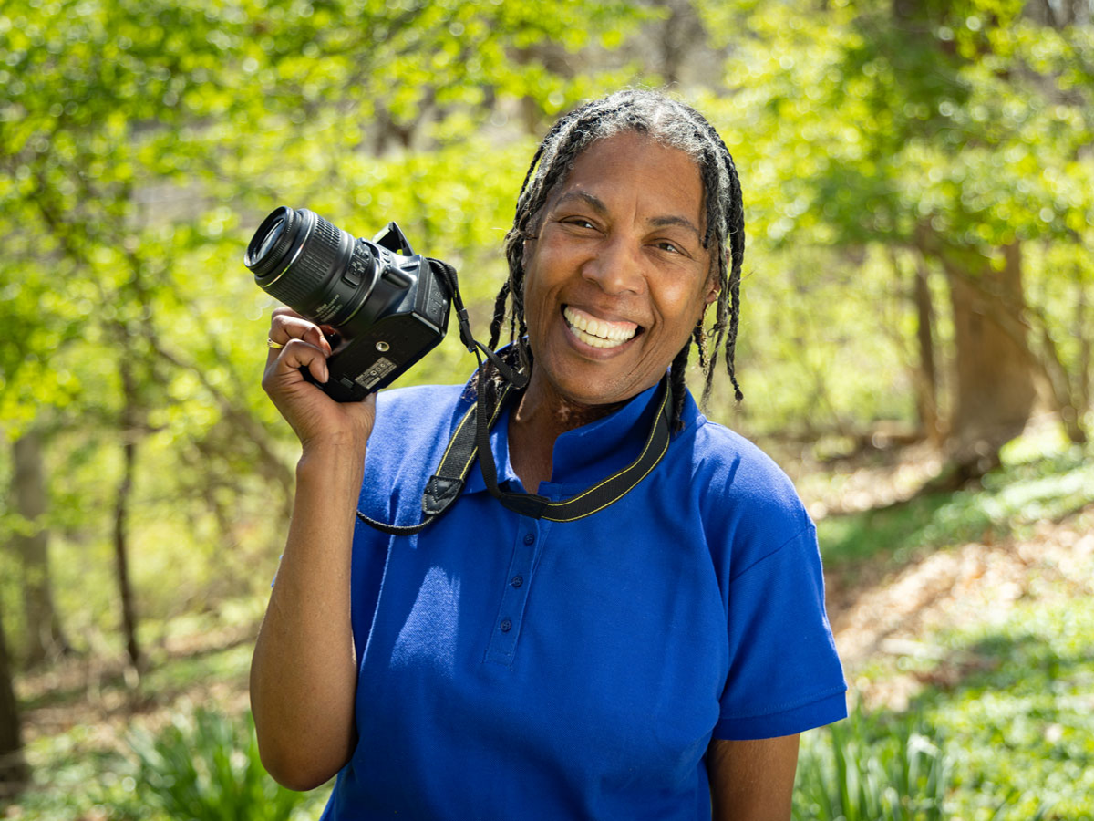 Joy West, with camera