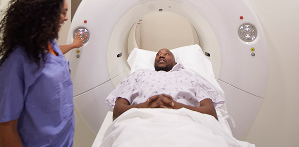Male patient lying in RapidArc machine