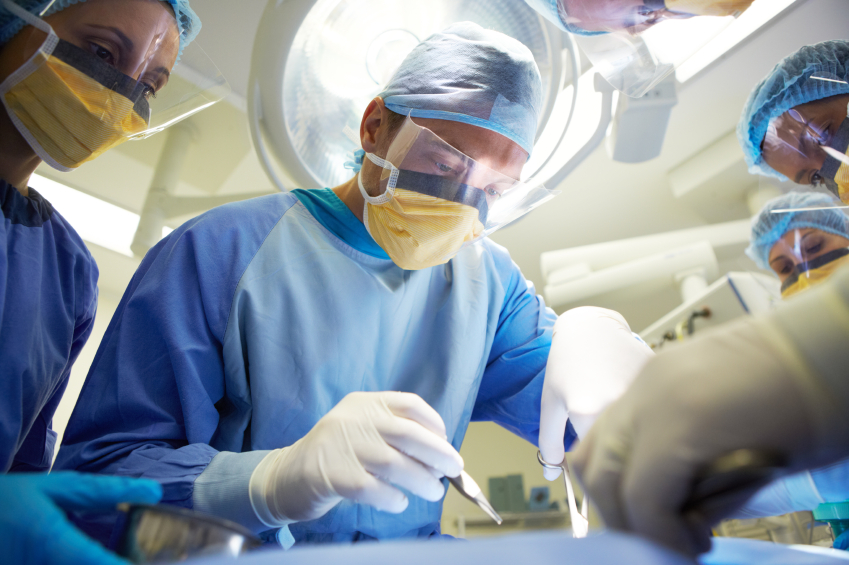 Doctors in the operating room performing surgery