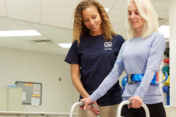 Female patient doing physical therapy with doctor