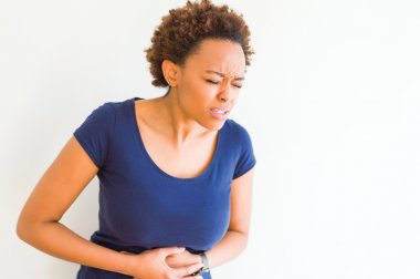 Woman holding her stomach in pain